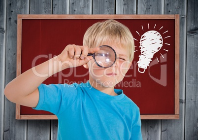 Composite image of kid looking for an idea against red tab and wood blackboard with lightbulb