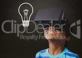 Composite image of kid wearing helmet against blackboard with lightbulb
