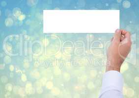 Composite image of Hand Holding white board against bright blue background