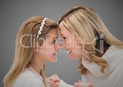 Composite image of a lovely girl with her mom against neutral background