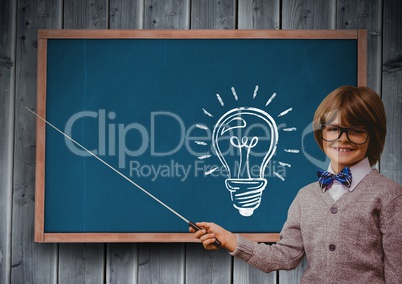 Composite image of intellectual kid against blackboard with lightbulb