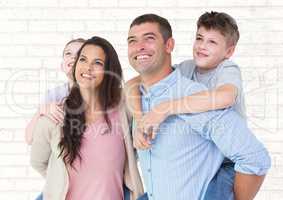 Composite image of parents with their children on their back against white wall