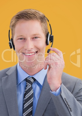 Travel agent using headset and smiling against a yellow background