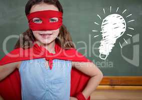 kid and blackboard with lightbulb against a black background