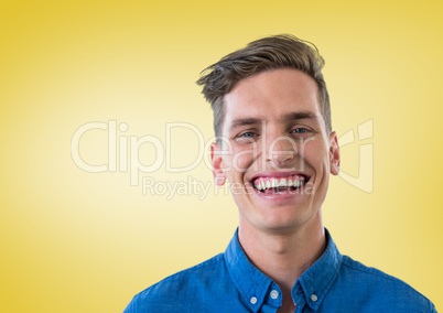 Portrait of a Happy Man smiling at camera against a yellow background