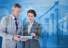 Composite image of Business people standing while looking at tablet against blue graph background