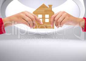 Composite image of Hands holding wood Home against white background