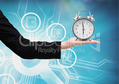 Composite image of Hand holding clocks against digital blue background