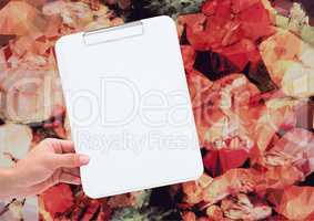 Composite image of Hand holding Note Board against graphic flowers background