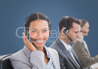 Composite image of Travel agents smiling against grey background