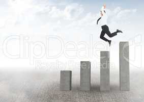 Businessman jumping on a graph against a light sky background