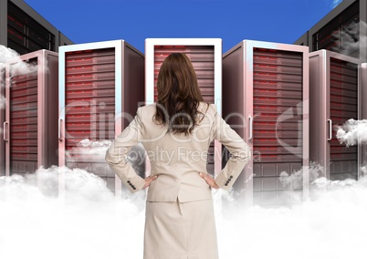 Businesswoman Standing looking at Graphic against a blue background