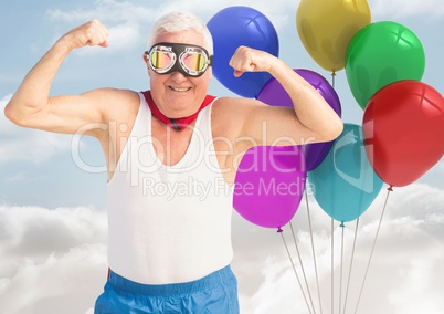 Strong Old Man with Balloons against a sky background