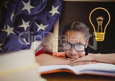 kid and blackboard with lightbulb against a black background