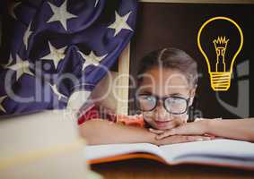 kid and blackboard with lightbulb against a black background