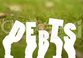 Debt letters against Grass background