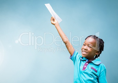 Happy Kid raising arm and holding paper against light blue background