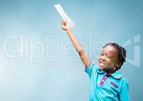 Happy Kid raising arm and holding paper against light blue background