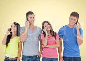 People using Phones against yellow background
