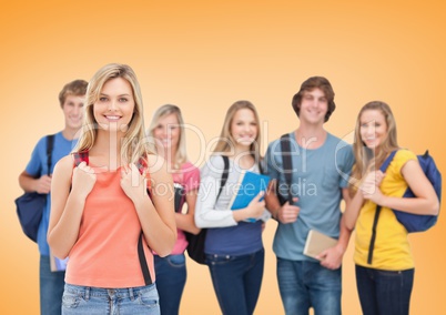 Students Smiling at camera against an orange background