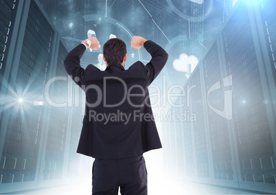Businessman Standing, raising his arms and looking at Graphic against a dark blue background