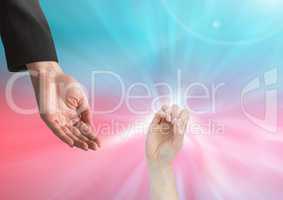 Composite Image of two Hands against a colorful background
