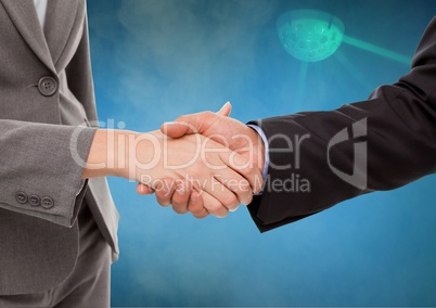 Businessmen Shaking Hands against a Light Blue Ray background