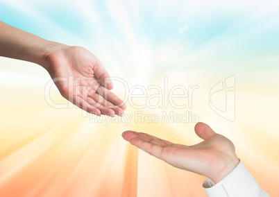 Composite image of A woman hand and a man hand against a rays of sunlight