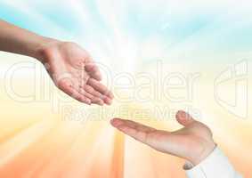 Composite image of A woman hand and a man hand against a rays of sunlight