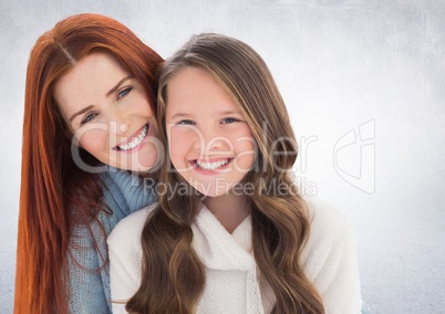 Mother and daugther against a neutral background
