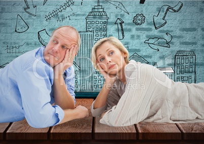 Composite image of Mature couple against a wall with sketches