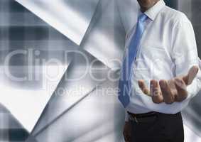 Composite image of businessman opening his hand against modern grey background