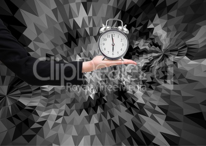 Composite image of business woman hand holding clock against graphic dark background