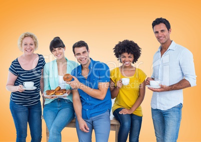Happy group of people Eating donus against orange background
