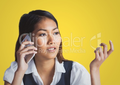 Travel agent speaking at phone against a yellow background