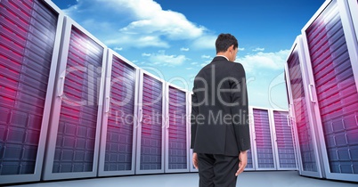 Businessman Standing and looking at Graphic against a colorful background