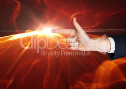 Composite image of Hand as a gun with a flame at the top of the finger against black background