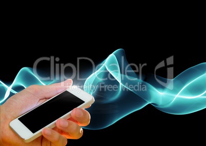 Composite image of Hand holding cell phone against smoke effects