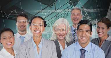 Business Team Smiling and Standing in front of Graph against blue background