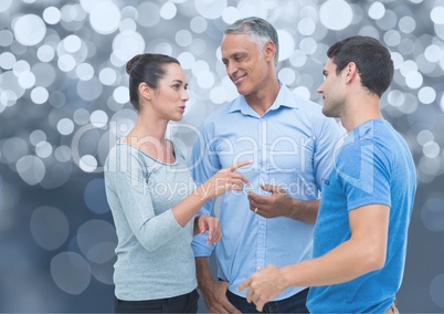 Group of people speaking against a shining grey background