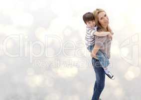Mother and her son against a neutral background