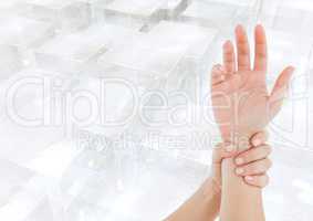 Composite image of hands restraining against overview of buildings