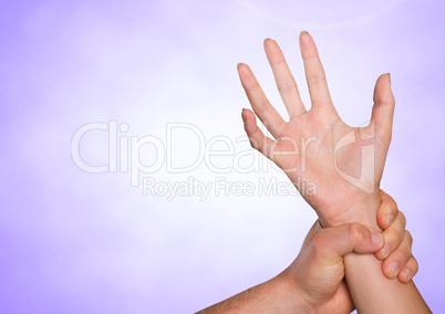 Composite image of Hands retaining against purple background
