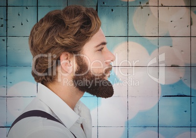 Man with beard against tiles with bokeh background