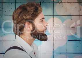 Man with beard against tiles with bokeh background