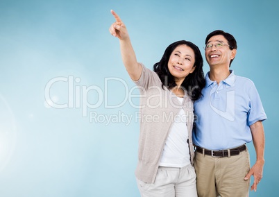 Happy Couple Hugging against a blue Background