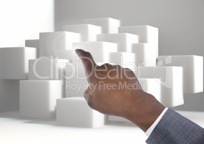 Composite image of Hand Pointing White cubes