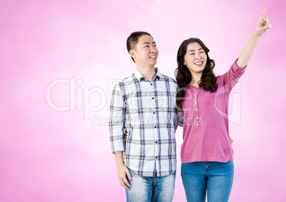 Happy Couple Having Fun against a pink Background