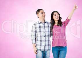 Happy Couple Having Fun against a pink Background