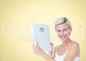 Woman holding Weight scales against a yellow background